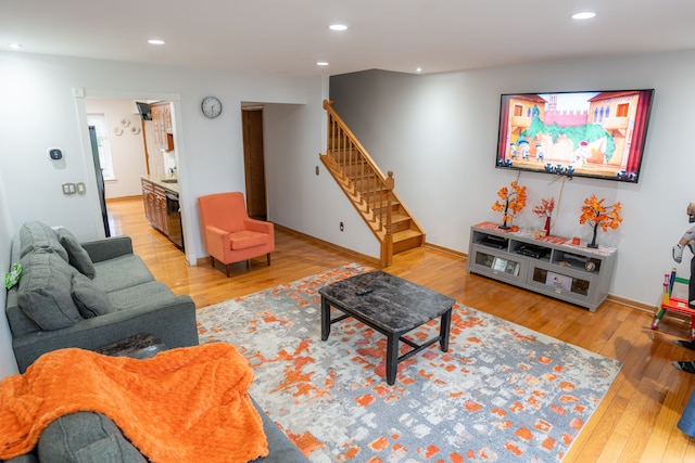 4468 15 Mile Rd Unit 104, Sterling Heights, MI 48310 - living area featuring stairs, wood finished floors, and recessed lighting