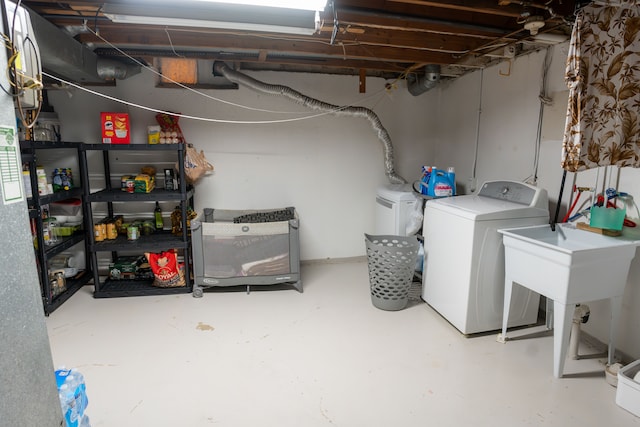 4468 15 Mile Rd Unit 104, Sterling Heights, MI 48310 - unfinished below grade area featuring washing machine and clothes dryer
