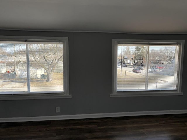 room details with baseboards and wood finished floors