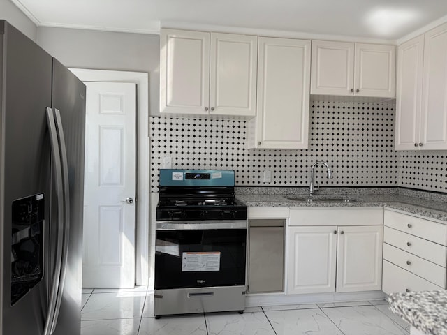 kitchen with backsplash, marble finish floor, appliances with stainless steel finishes, and a sink