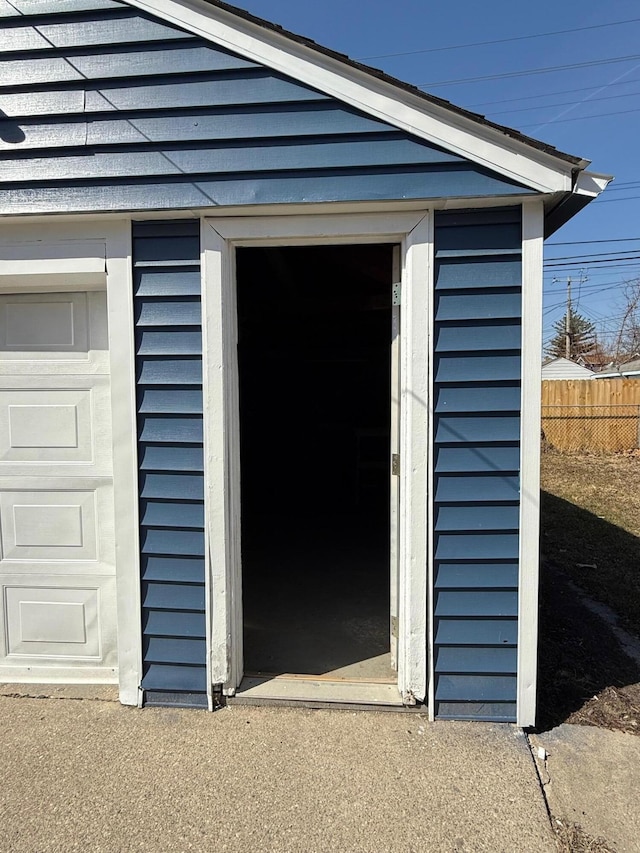 garage with fence