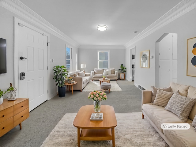 carpeted living room with crown molding, baseboards, and visible vents