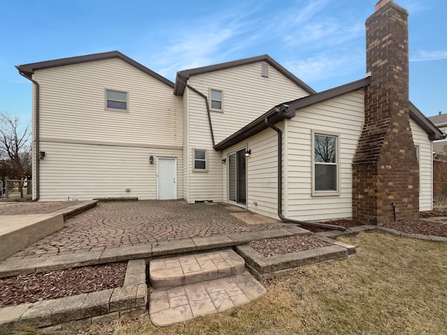 back of house with a patio