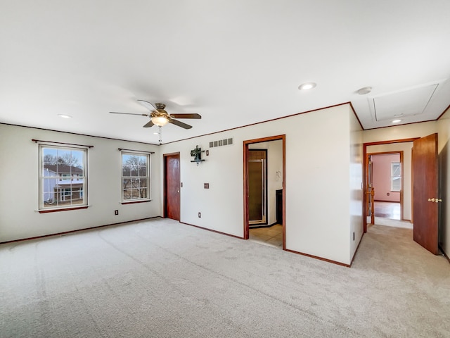 spare room with visible vents, baseboards, light colored carpet, recessed lighting, and a ceiling fan