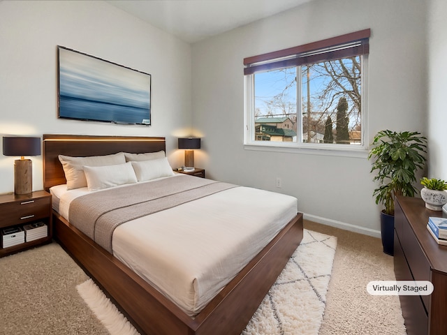 carpeted bedroom with baseboards