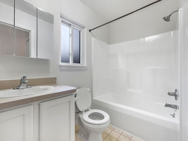 bathroom with vanity, toilet, and shower / bathtub combination