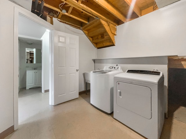 laundry area with separate washer and dryer and laundry area