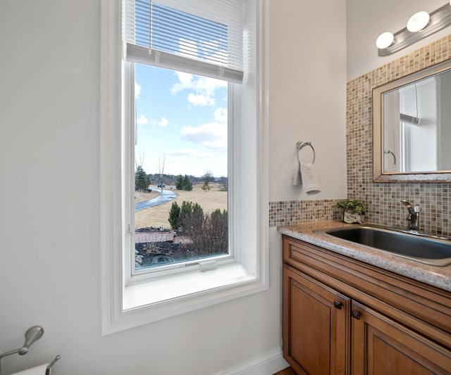 bathroom featuring decorative backsplash and vanity