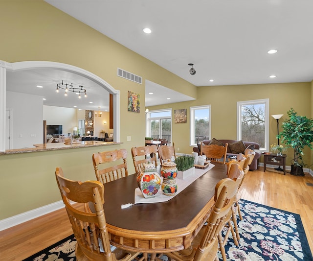 dining area with recessed lighting, baseboards, visible vents, and light wood-type flooring