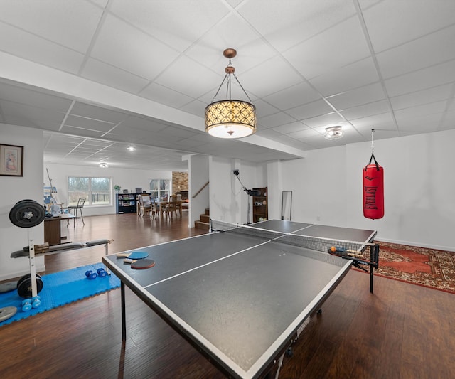 rec room featuring a paneled ceiling and wood finished floors