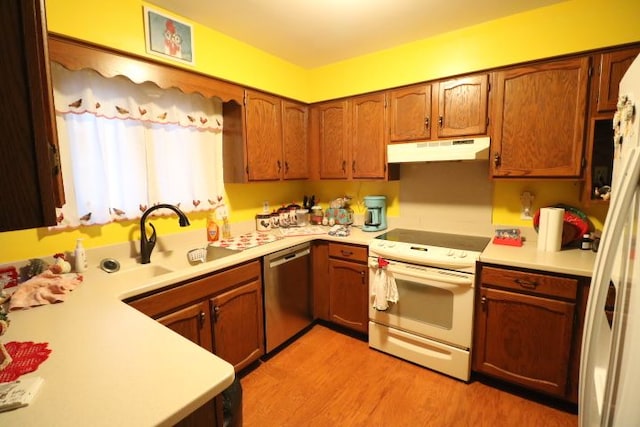 kitchen featuring dishwasher, white electric range oven, light countertops, and under cabinet range hood