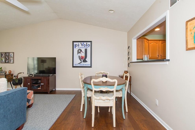 dining area with recessed lighting, dark wood-type flooring, baseboards, and vaulted ceiling