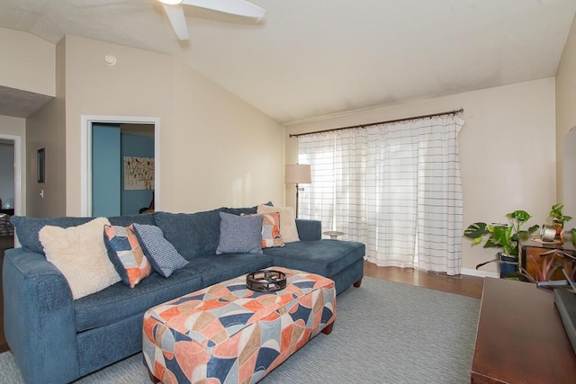 living room featuring a ceiling fan, lofted ceiling, and wood finished floors