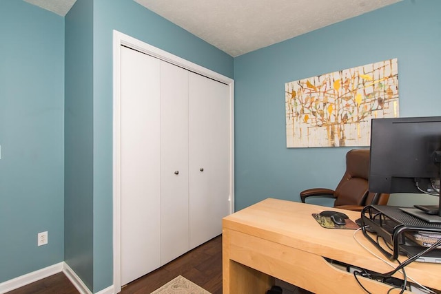 office with baseboards, a textured ceiling, and dark wood-style flooring