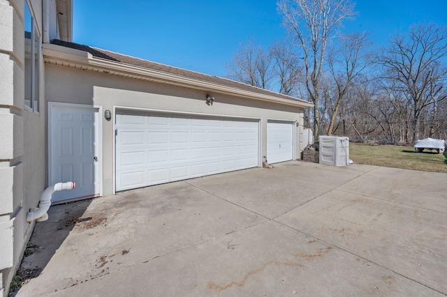 garage featuring driveway