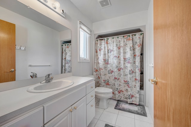 full bathroom with tile patterned flooring, toilet, vanity, and visible vents