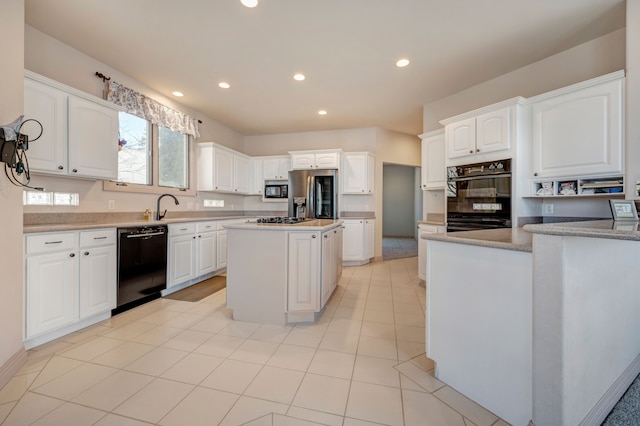 kitchen with black appliances, a kitchen island, recessed lighting, white cabinets, and light tile patterned floors