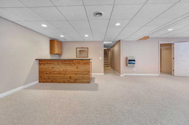 bar featuring visible vents, baseboards, stairway, light carpet, and heating unit