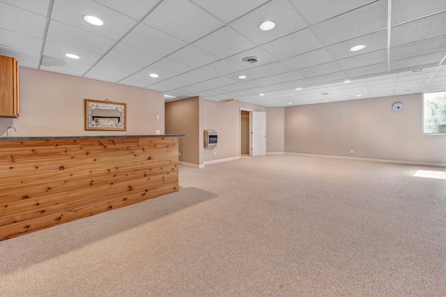 interior space with heating unit, visible vents, baseboards, recessed lighting, and light colored carpet