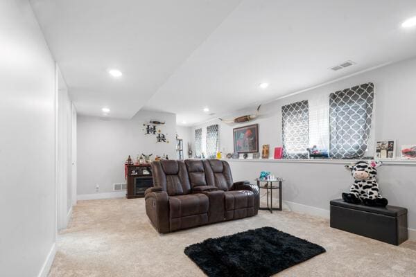 living room featuring visible vents, recessed lighting, carpet, and baseboards