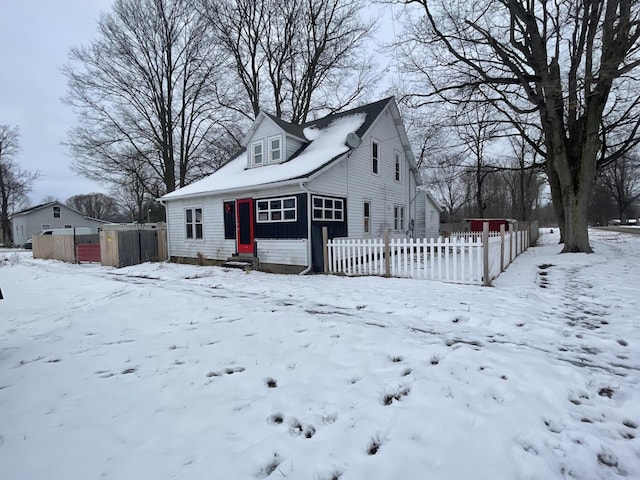 view of front facade featuring a garage and fence