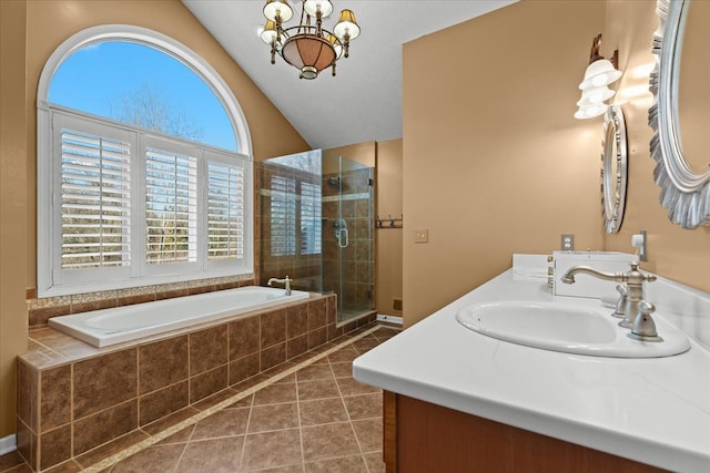 full bathroom with a chandelier, a stall shower, a bath, tile patterned floors, and a sink