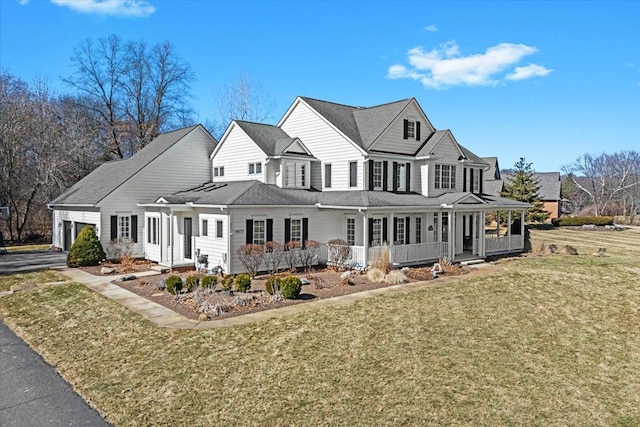 view of front of property featuring a front lawn and covered porch