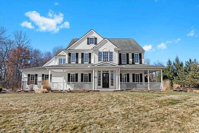 view of front of home with a front yard and covered porch