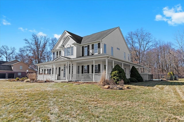 view of front of property featuring covered porch and a front lawn