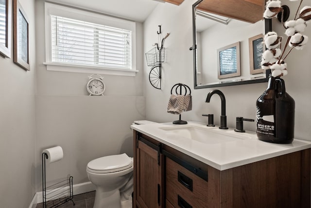 bathroom with tile patterned floors, toilet, and vanity