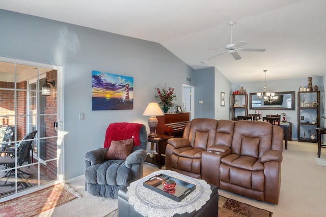 living area featuring ceiling fan with notable chandelier, vaulted ceiling, light colored carpet, and baseboards