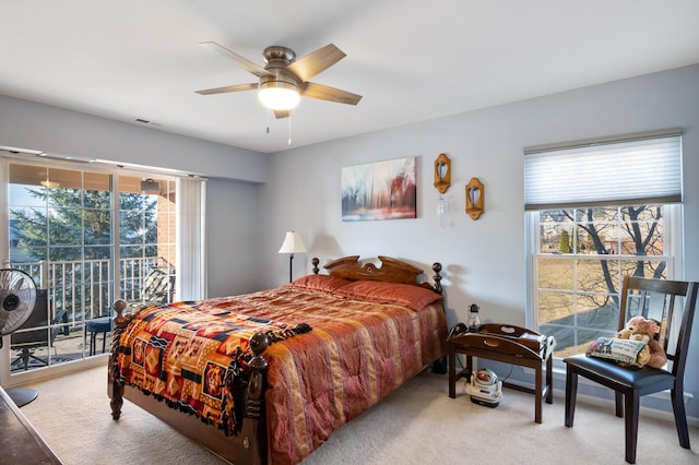 bedroom featuring access to exterior, carpet, visible vents, and ceiling fan