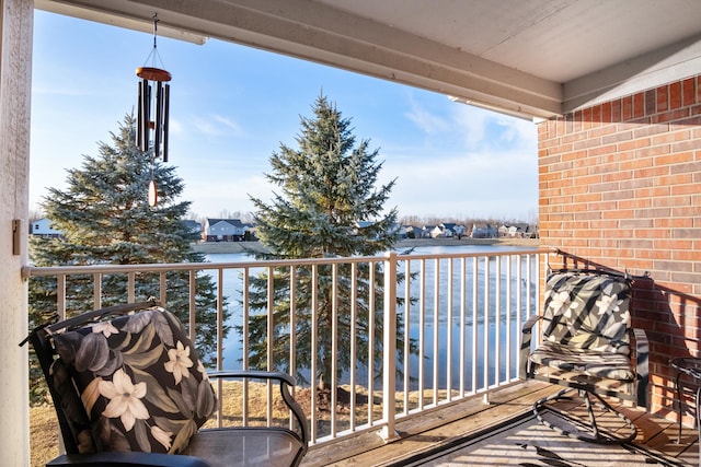 balcony featuring a water view