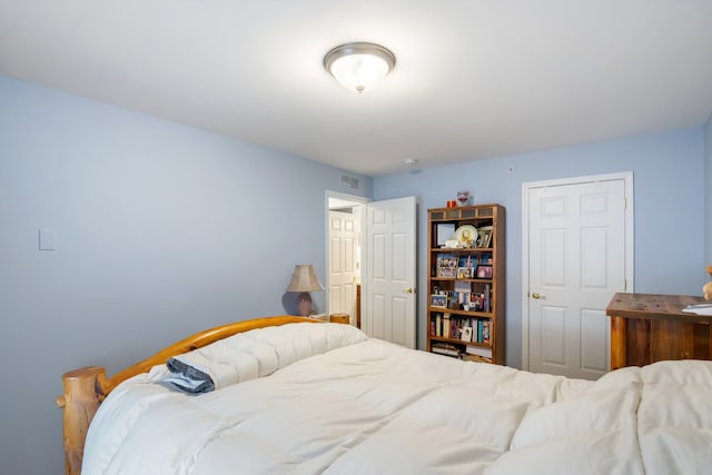 bedroom featuring visible vents