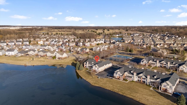 bird's eye view with a residential view and a water view