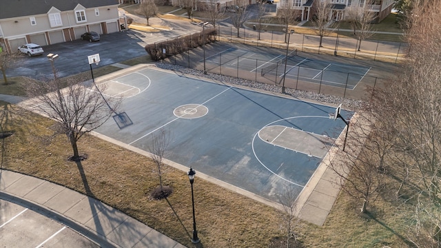 view of basketball court featuring community basketball court and fence