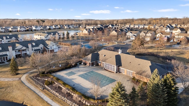 bird's eye view featuring a residential view and a water view