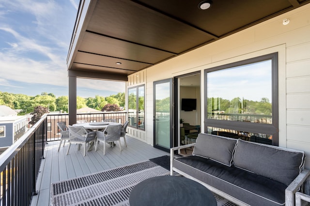 balcony featuring outdoor dining space