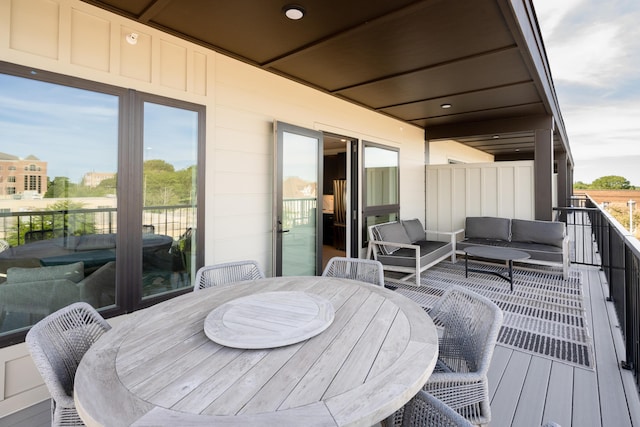 deck featuring outdoor dining space and an outdoor living space