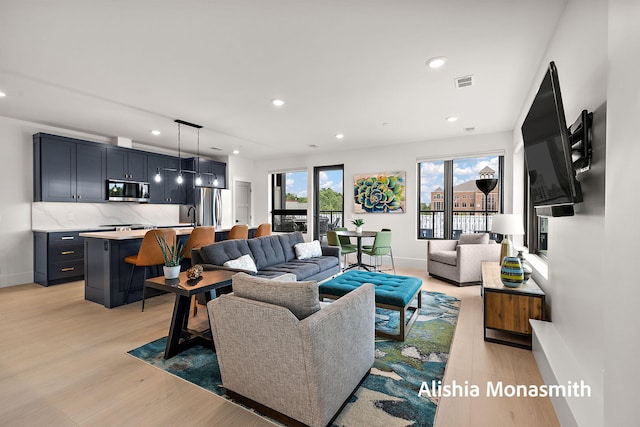 300 Washington Ave Unit 1, Grand Haven, MI 49417 - living room featuring recessed lighting and light wood-style floors