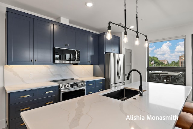 300 Washington Ave Unit 1, Grand Haven, MI 49417 - kitchen with stainless steel appliances, decorative backsplash, light stone countertops, blue cabinetry, and decorative light fixtures