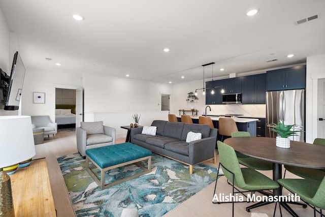 300 Washington Ave Unit 1, Grand Haven, MI 49417 - living room with light wood-type flooring and recessed lighting