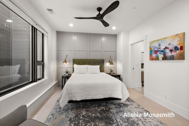 300 Washington Ave Unit 1, Grand Haven, MI 49417 - bedroom featuring light wood-style flooring, recessed lighting, a decorative wall, and a ceiling fan