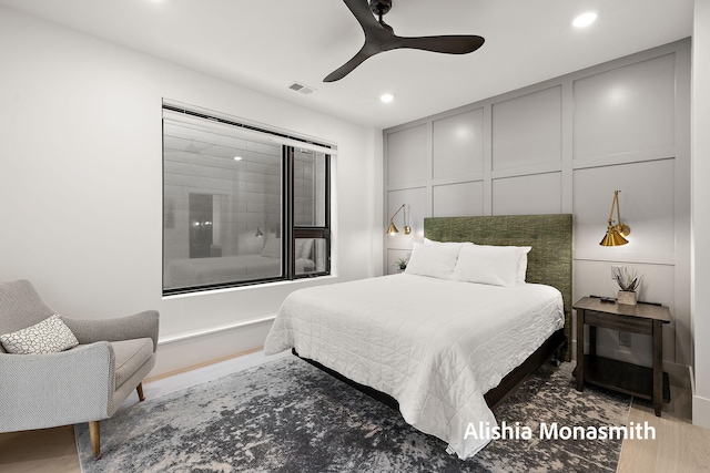 300 Washington Ave Unit 1, Grand Haven, MI 49417 - bedroom featuring a decorative wall, recessed lighting, ceiling fan, and wood finished floors