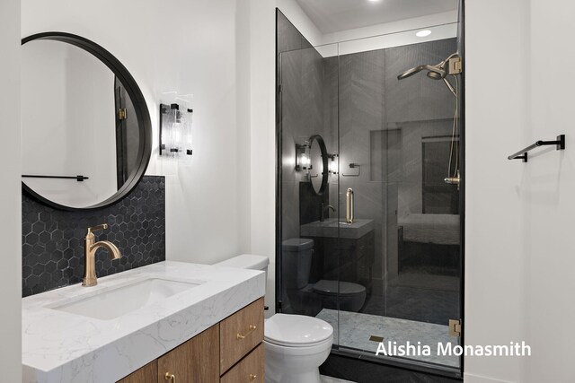 300 Washington Ave Unit 1, Grand Haven, MI 49417 - full bathroom featuring vanity, a shower stall, and decorative backsplash