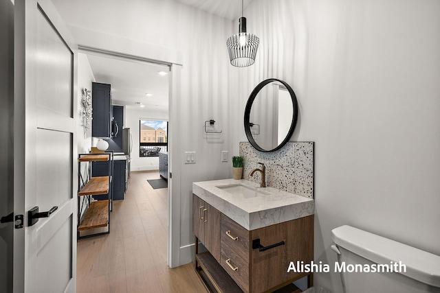 300 Washington Ave Unit 1, Grand Haven, MI 49417 - bathroom with vanity and wood finished floors