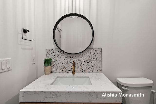 300 Washington Ave Unit 1, Grand Haven, MI 49417 - bathroom featuring vanity and decorative backsplash