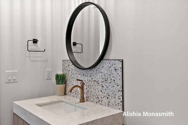 300 Washington Ave Unit 1, Grand Haven, MI 49417 - bathroom featuring vanity and backsplash