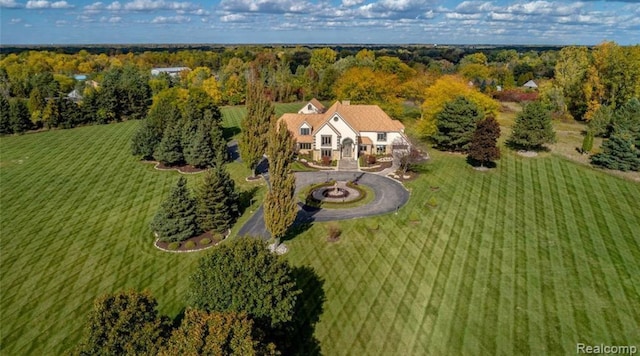 bird's eye view featuring a wooded view