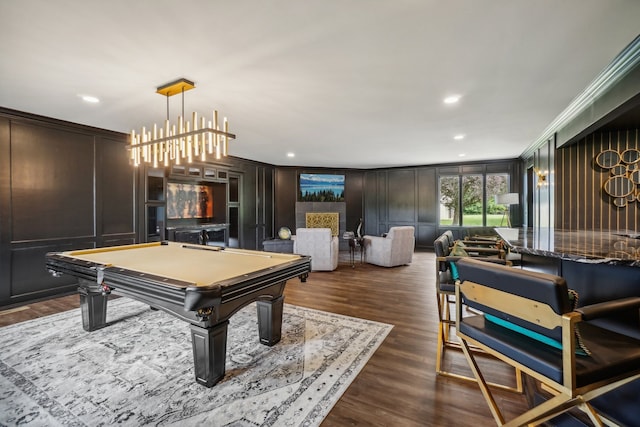 rec room featuring dark wood finished floors, recessed lighting, a decorative wall, pool table, and crown molding